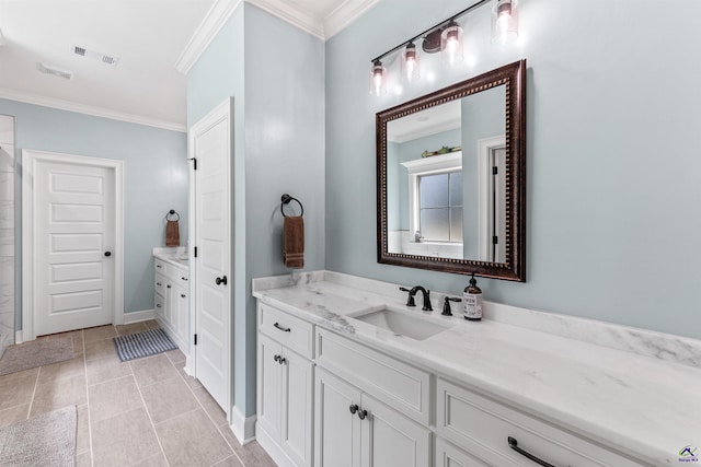 full bath with crown molding, vanity, and tile patterned flooring