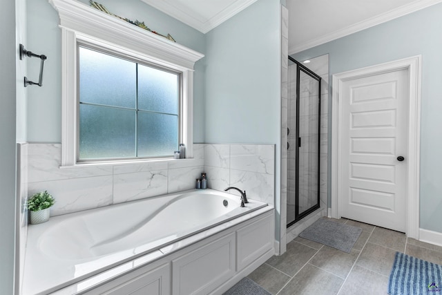 bathroom with a shower stall, a bath, ornamental molding, and tile patterned floors