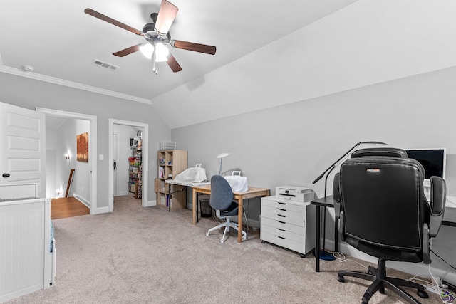 carpeted home office featuring a ceiling fan, crown molding, lofted ceiling, and baseboards