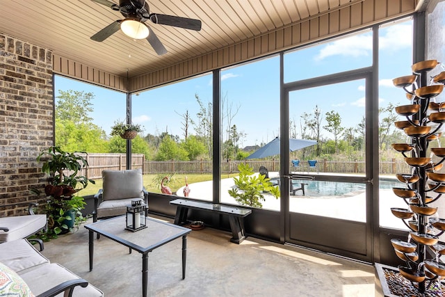 sunroom with a ceiling fan