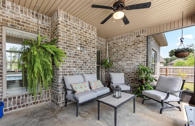 view of patio with outdoor lounge area, a ceiling fan, and fence