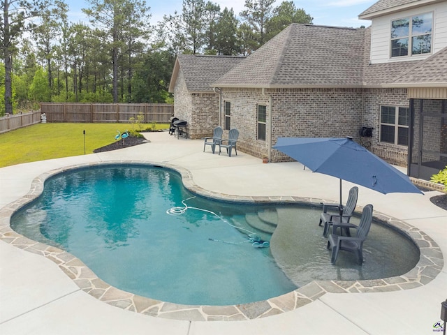 view of swimming pool with a patio area