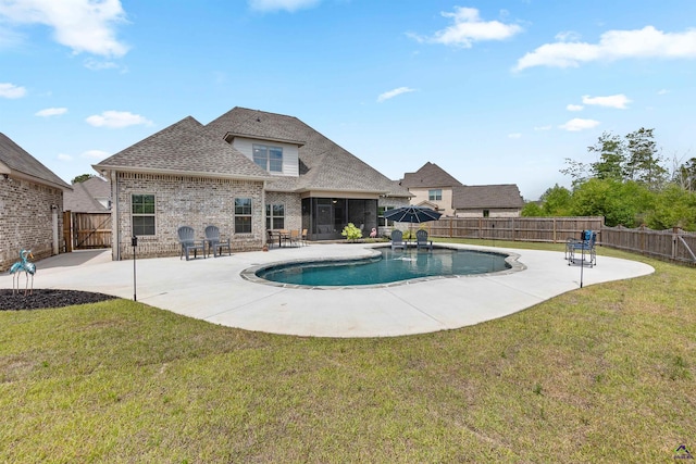 view of pool featuring a sunroom and a patio