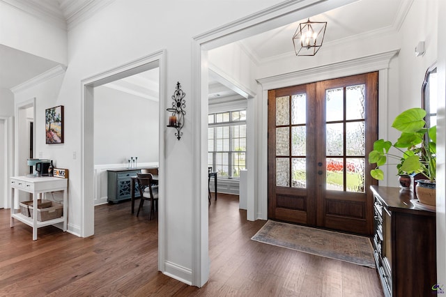 entryway with french doors, healthy amount of natural light, dark wood-style flooring, and crown molding