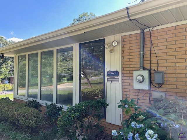 exterior view of electric meter and brick siding