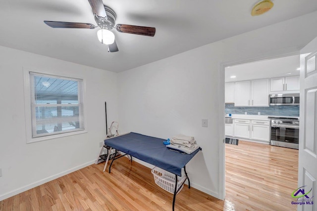 257 Macon Rd, Reynolds, GA 31076 - office area with light wood finished floors, ceiling fan, and baseboards