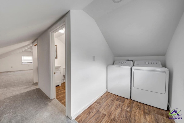 257 Macon Rd, Reynolds, GA 31076 - laundry area featuring independent washer and dryer, wood finished floors, carpet floors, and baseboards