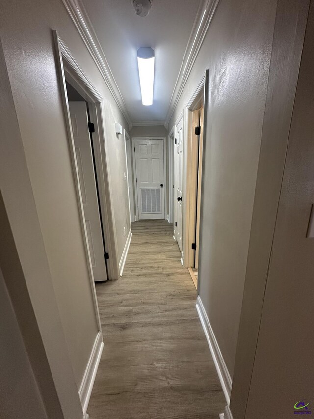 103 Ridley Ct, Warner Robins, GA 31088 - hallway featuring ornamental molding, wood finished floors, and baseboards
