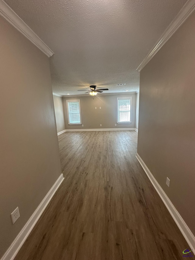 103 Ridley Ct, Warner Robins, GA 31088 - empty room with crown molding, a textured ceiling, baseboards, dark wood-style floors, and a ceiling fan