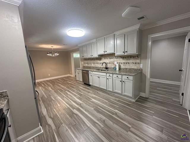 103 Ridley Ct, Warner Robins, GA 31088 - kitchen featuring dishwasher, a sink, baseboards, decorative backsplash, and crown molding