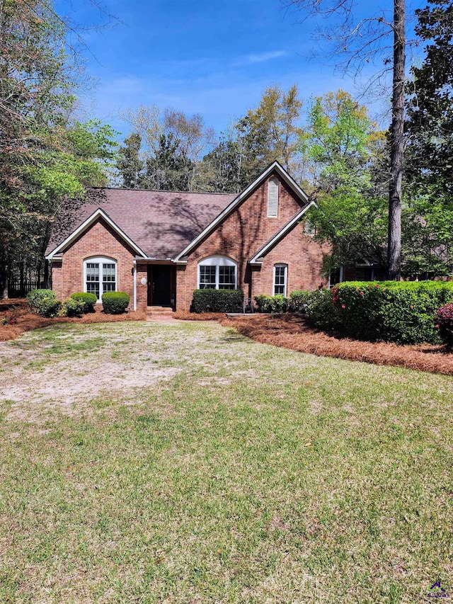 213 Falcon Crst, Warner Robins, GA 31088 - view of front of home featuring a front yard and brick siding