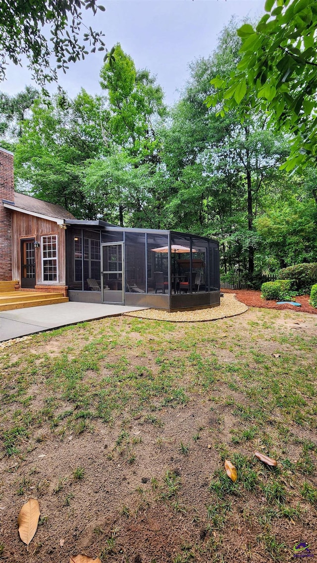213 Falcon Crst, Warner Robins, GA 31088 - view of yard with a sunroom