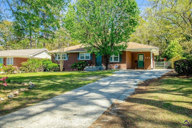 single story home with driveway, a carport, and roof with shingles