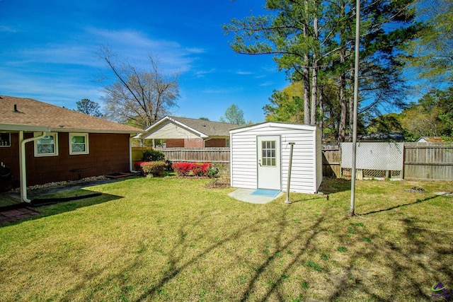 view of yard with an outdoor structure and a storage shed