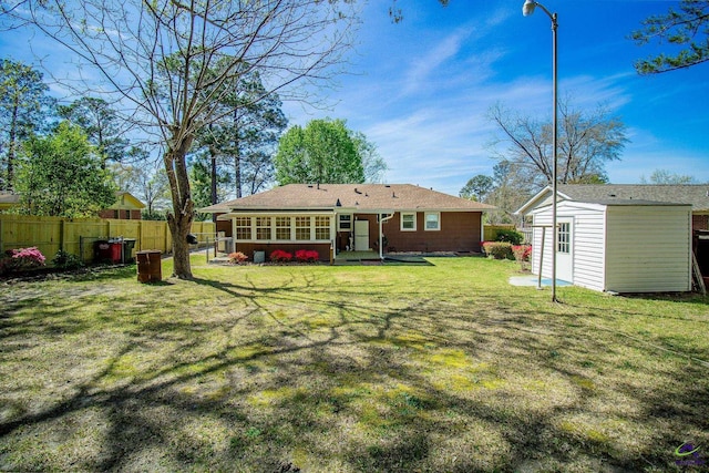back of property featuring an outdoor structure