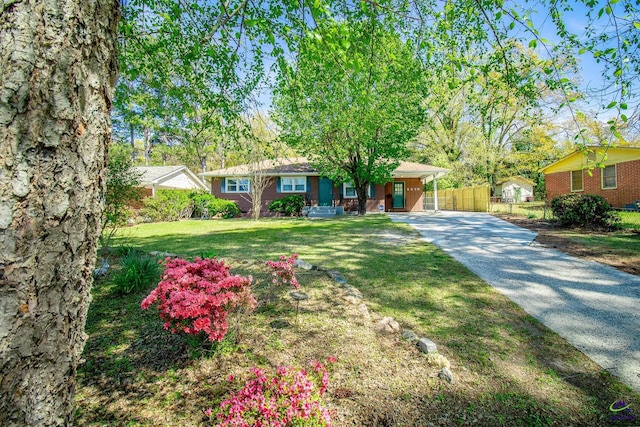 ranch-style home with driveway