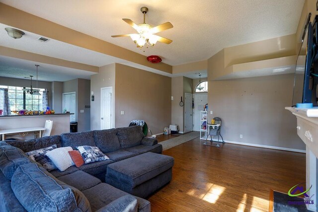 209 Ridgestone, Warner Robins, GA 31088 - living room featuring wood finished floors, ceiling fan, baseboards, and a chandelier