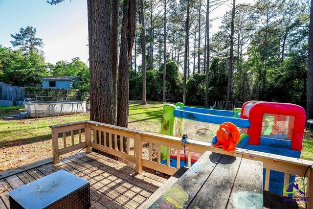 209 Ridgestone, Warner Robins, GA 31088 - wooden terrace with an outdoor pool and a lawn