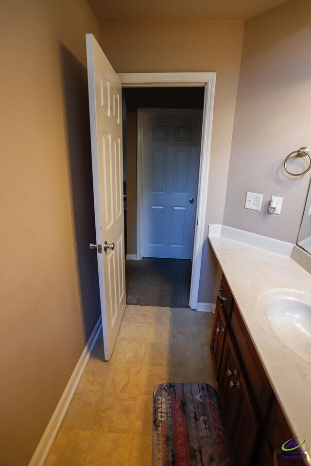 209 Ridgestone, Warner Robins, GA 31088 - bathroom with vanity and baseboards