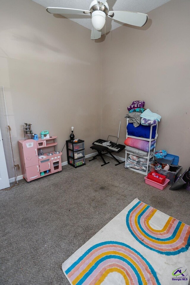 209 Ridgestone, Warner Robins, GA 31088 - recreation room featuring carpet flooring, a ceiling fan, and baseboards