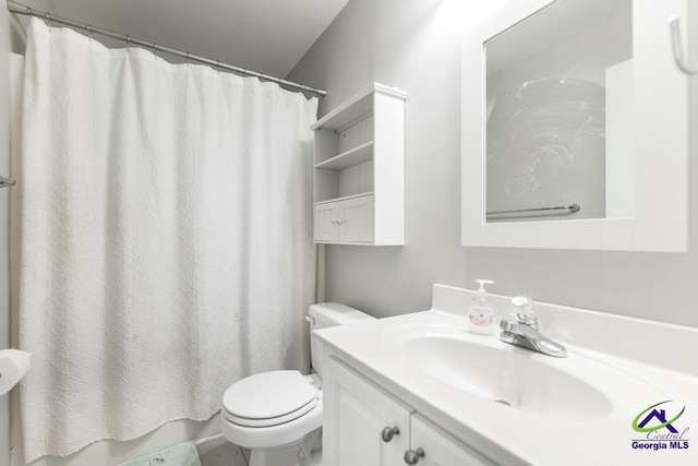 full bath with toilet and vanity