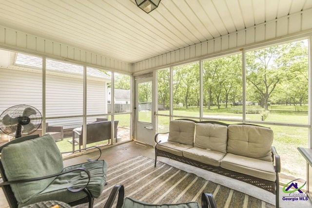 sunroom with an outdoor living space