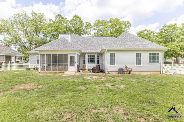 back of property with a sunroom, a shingled roof, a chimney, and central air condition unit