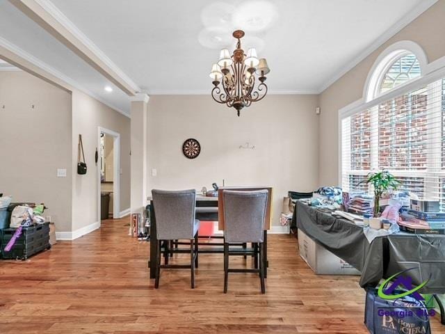 163 Broadleaf Dr, Macon, GA 31210 - dining room with light wood-style flooring, crown molding, a chandelier, and baseboards