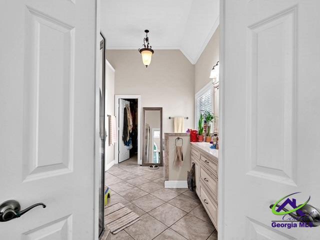 163 Broadleaf Dr, Macon, GA 31210 - bathroom with ornamental molding, vanity, vaulted ceiling, and tile patterned floors