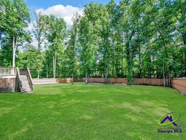 163 Broadleaf Dr, Macon, GA 31210 - view of yard with stairs and a wooden deck