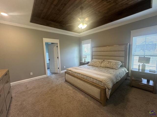 bedroom with carpet flooring, wood ceiling, baseboards, crown molding, and a raised ceiling