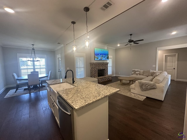 kitchen featuring dishwasher, baseboards, dark wood-style flooring, a sink, and ornamental molding