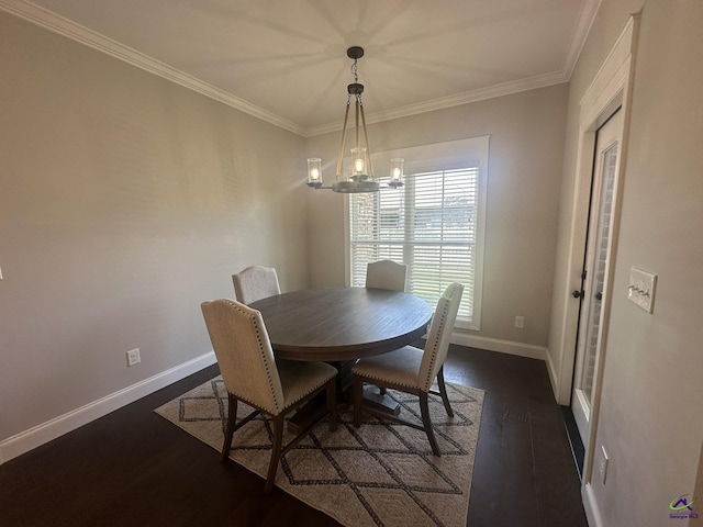 dining room featuring dark wood finished floors, a chandelier, ornamental molding, and baseboards
