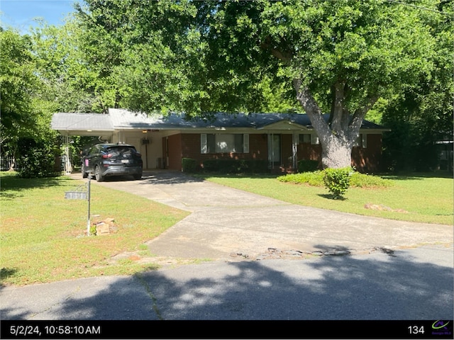 111 Mason Dr, Centerville, GA 31028 - single story home with a front yard, driveway, and an attached carport
