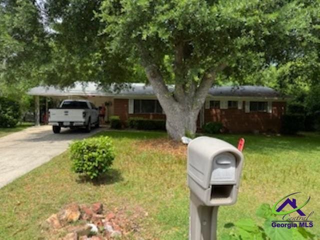 111 Mason Dr, Centerville, GA 31028 - ranch-style home with a front lawn and driveway