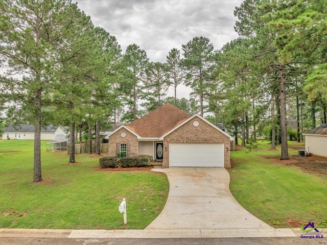 view of front facade featuring brick siding, a garage, driveway, and a front lawn