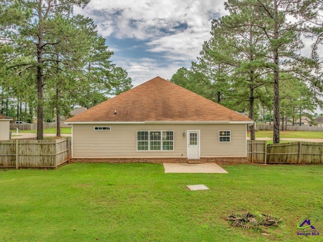 rear view of property featuring a shingled roof