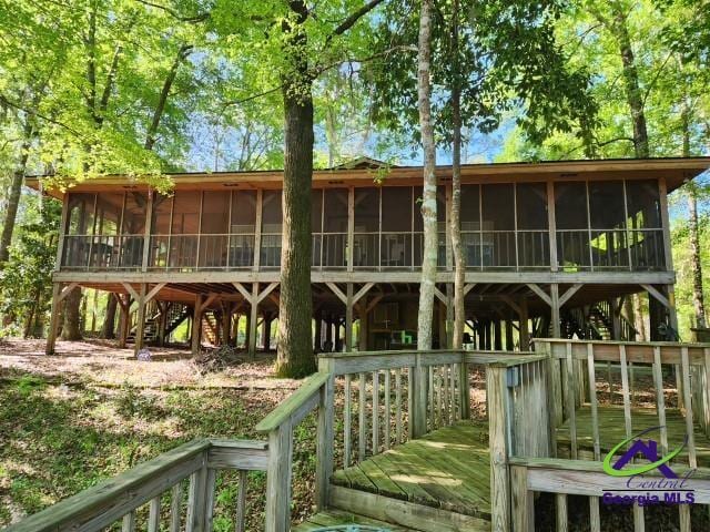 29 Riverview Dr, Hawkinsville, GA 31036 - rear view of house featuring a sunroom