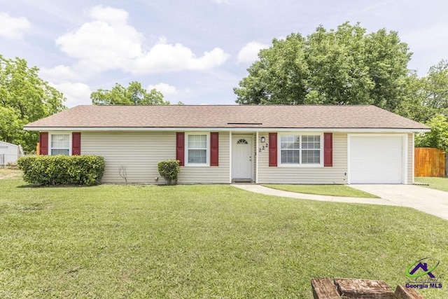 ranch-style home featuring an attached garage, concrete driveway, and a shingled roof