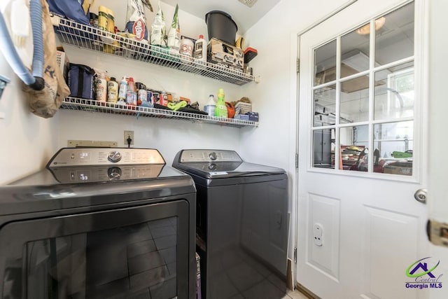 laundry area with washing machine and dryer