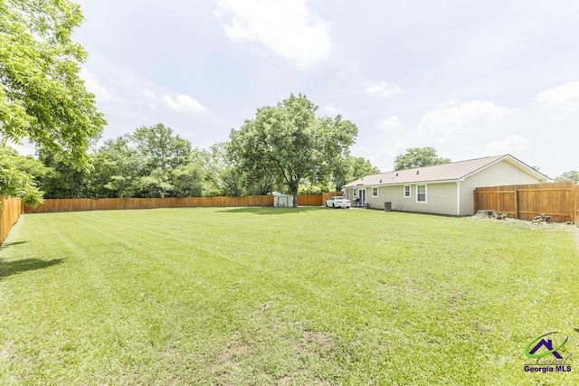 view of yard with a shed and an outdoor structure