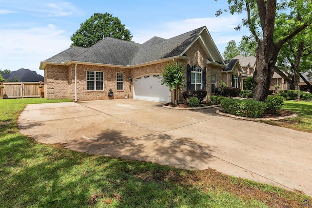 view of front of property featuring brick siding, a garage, concrete driveway, and roof with shingles
