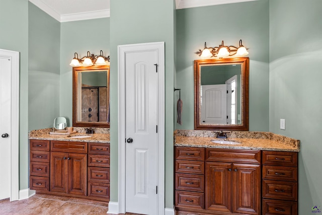 bathroom featuring crown molding, two vanities, and tile patterned flooring
