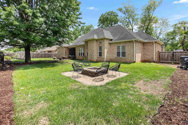 back of property with a patio area, brick siding, a fire pit, and roof with shingles