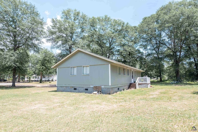 22 Waterford Way, Hawkinsville, GA 31036 - view of home's exterior with crawl space, a lawn, and a deck