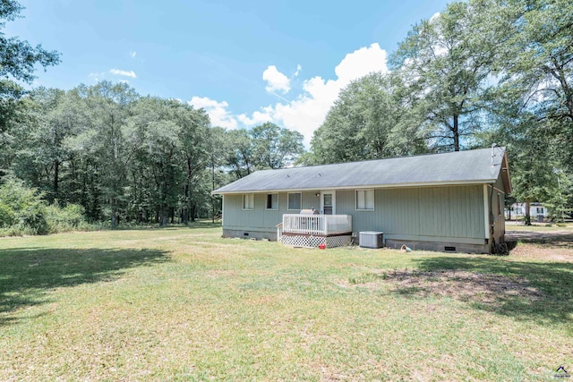 22 Waterford Way, Hawkinsville, GA 31036 - rear view of house featuring crawl space, central AC unit, a lawn, and a deck