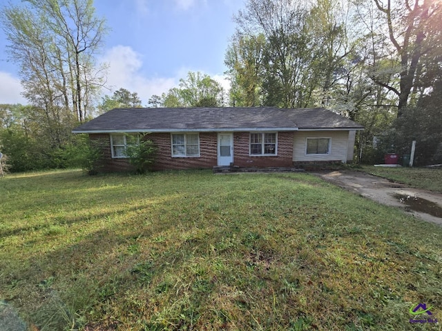 ranch-style house with a front lawn