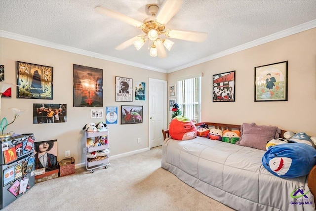 bedroom featuring crown molding, a textured ceiling, carpet floors, a ceiling fan, and baseboards