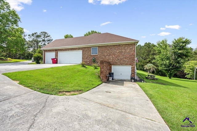 view of home's exterior with concrete driveway, a yard, and brick siding