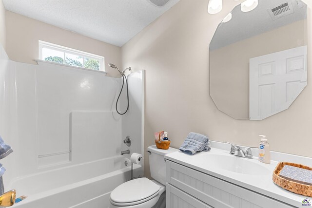 full bathroom with bathtub / shower combination, vanity, and toilet